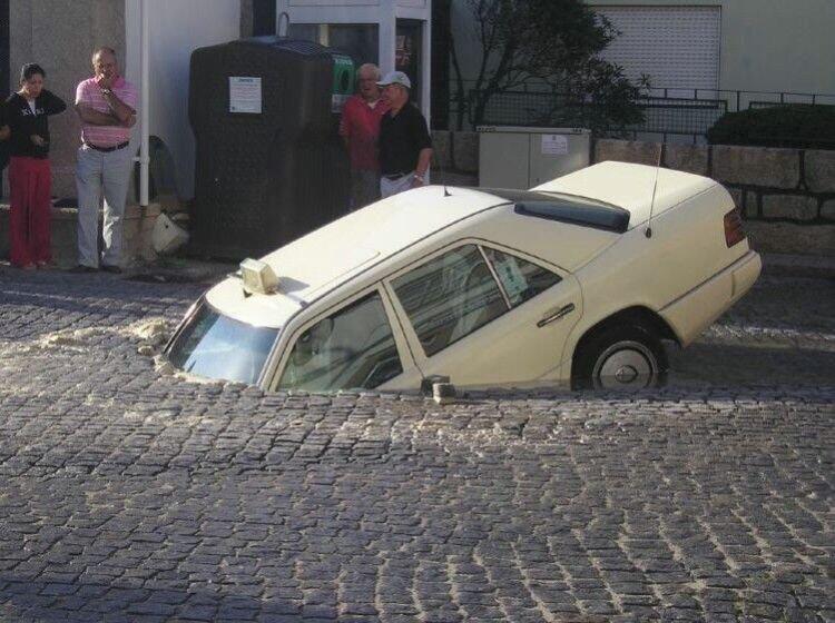 Funny picture of Car stuck in ground